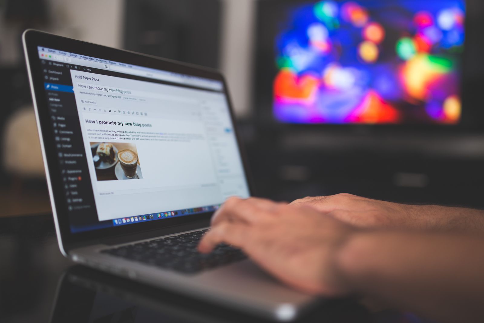 Writer editing a blog post on a laptop screen